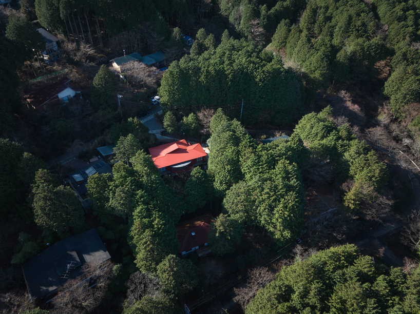 elevated circular veranda and canopy wrap 60-year-old restored japanese house