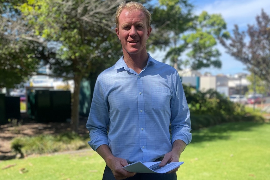 A man stands in a garden