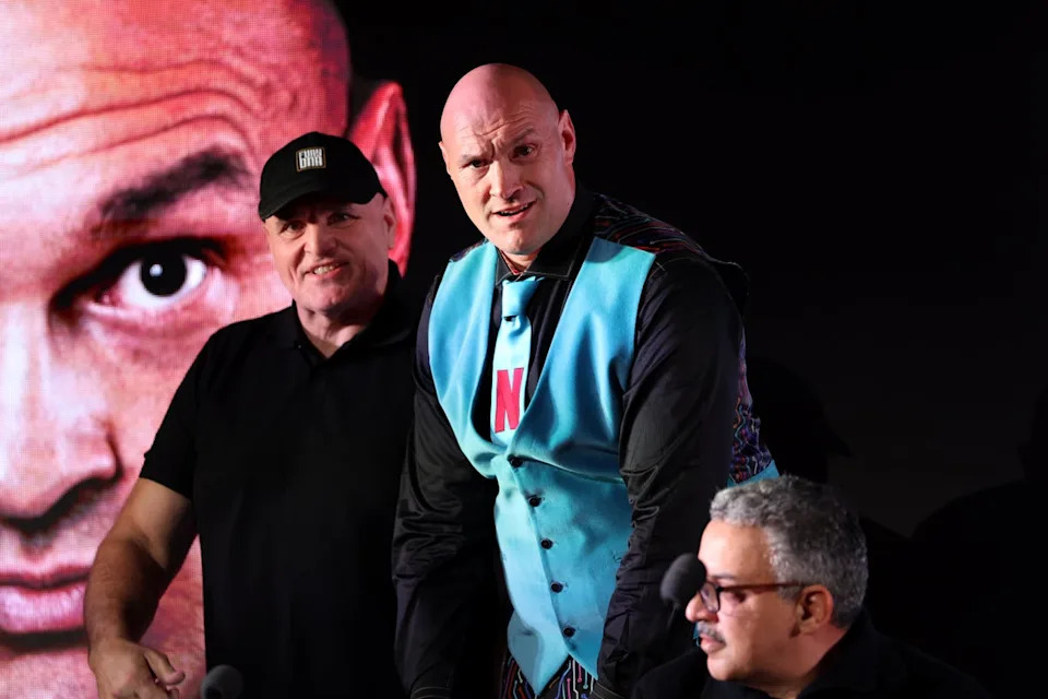 Tyson Fury (right), pictured with his father John, at a press conference for his latest return to boxing (Getty)