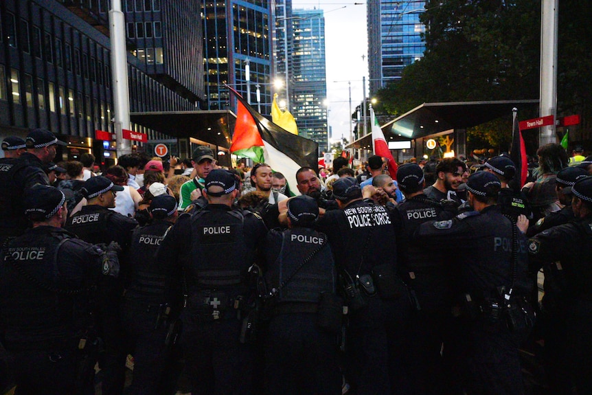 A large group of protesters clash with police