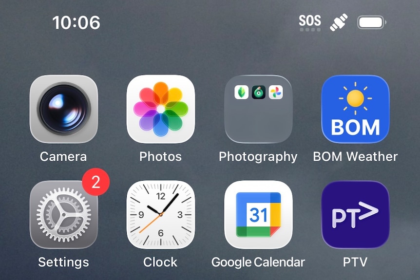 A home screen of a phone showing apps and SOS in top right hand corner.