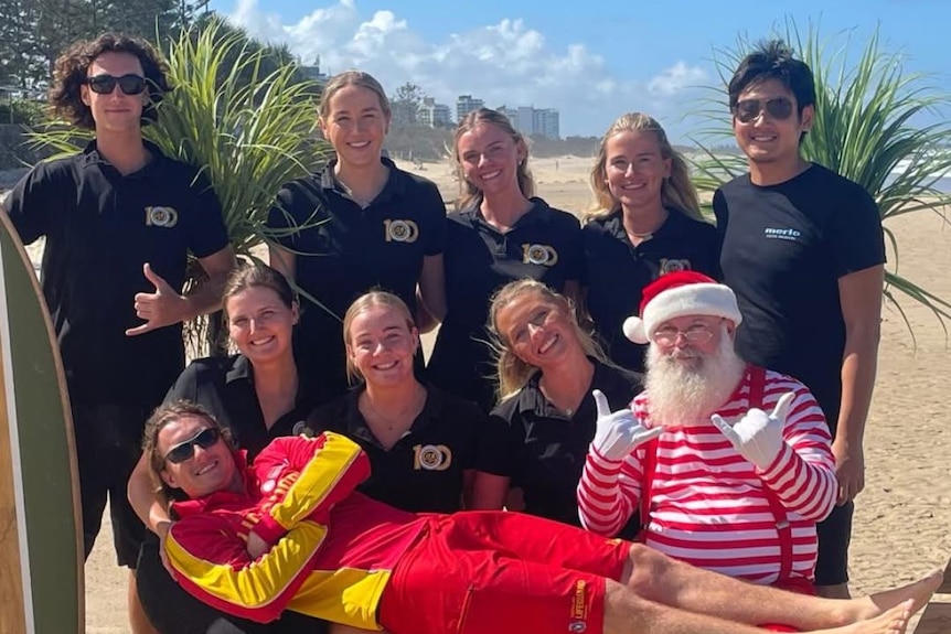 Ms Day sits amoungst colleagues at a Christmas celebration.