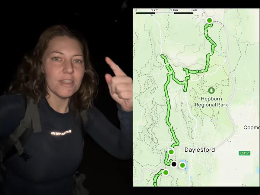 a woman is walking in the dark 