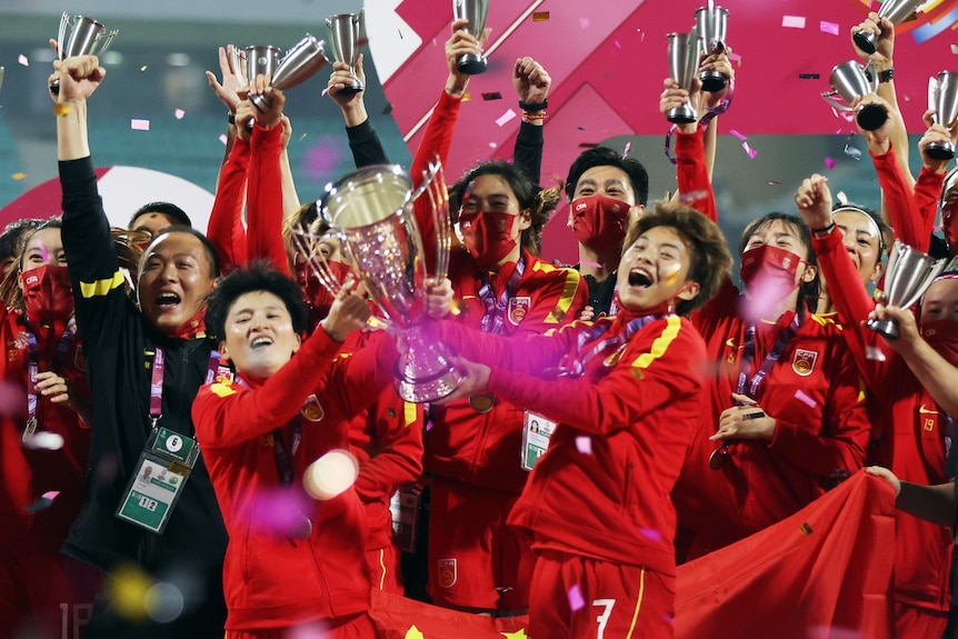 AFC Cup Wang Shuang and Wang Shanshan hold the trophy and celebrate with team members after the match REUTERSFrancis Mascarenhas