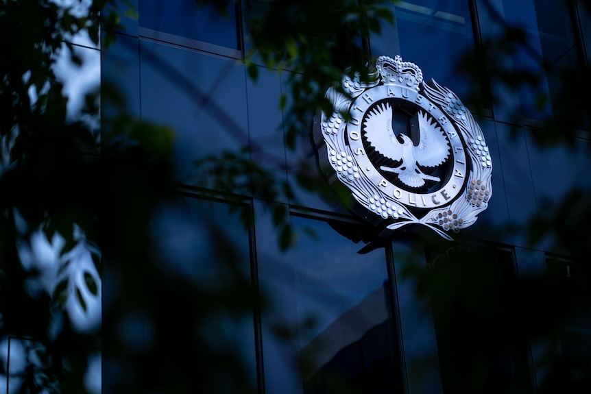 The South Australia Police logo on a building. 