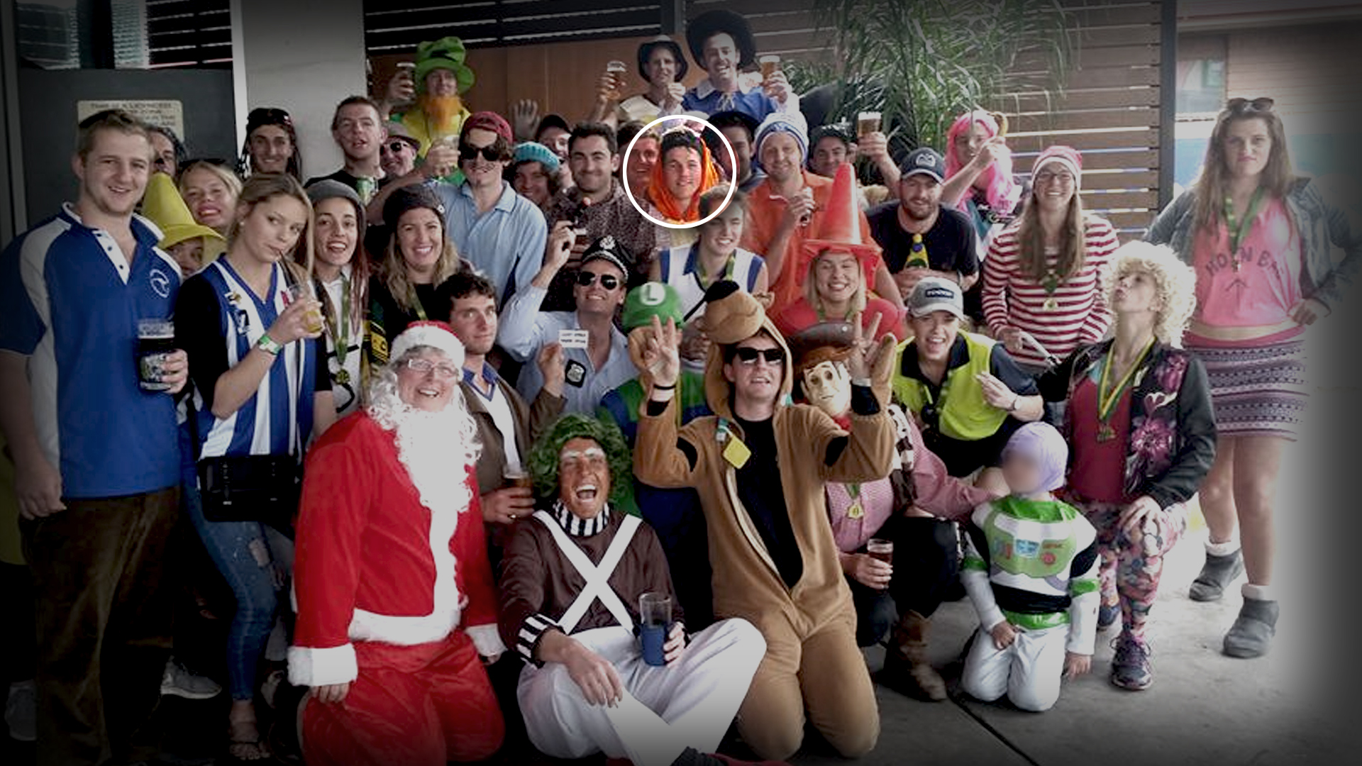 A group of people dressed in costumes for an end-of-year football club celebration.