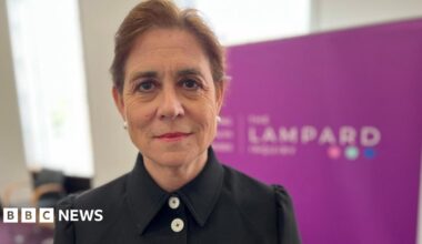 Bereaved relatives affected by mental health deaths in Essex stand outside Arundel House in London. They are holding posters and photographs of loved ones who have died. One is also holding an Essex flag. The largest banner reads: "If mental health trusts in Essex had learned from mistakes, there would be one death instead of thousands of deaths".