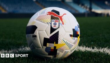 A close up of Puma's rainbow ball that features a selection of colourful geometrical shapes on a traditional white background