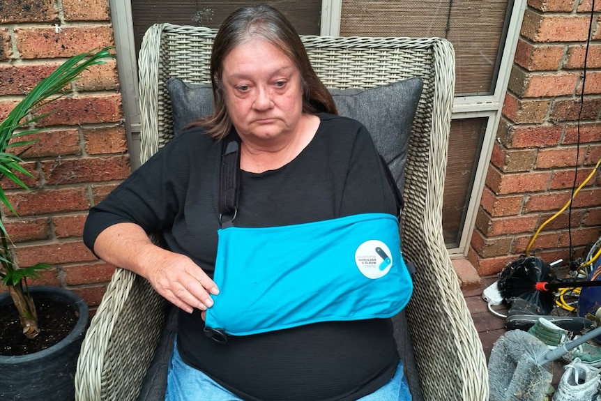 Marie Cox with her shoulder in a sling