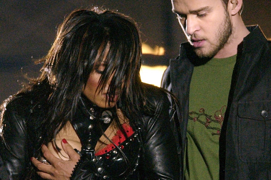 Janet Jackson covers her breast after a wardrobe malfunction during the halftime performance with Justin Timberlake