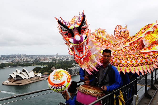 A 15-metre Chinese dragon dances up the eastern arch of the Harbour Bridge