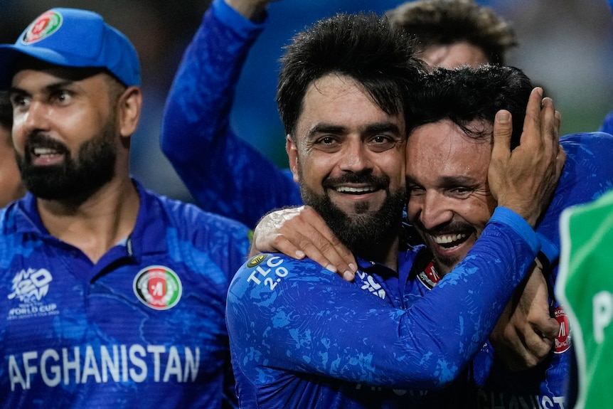 Rashid Khan hugs Gulbadin Naib