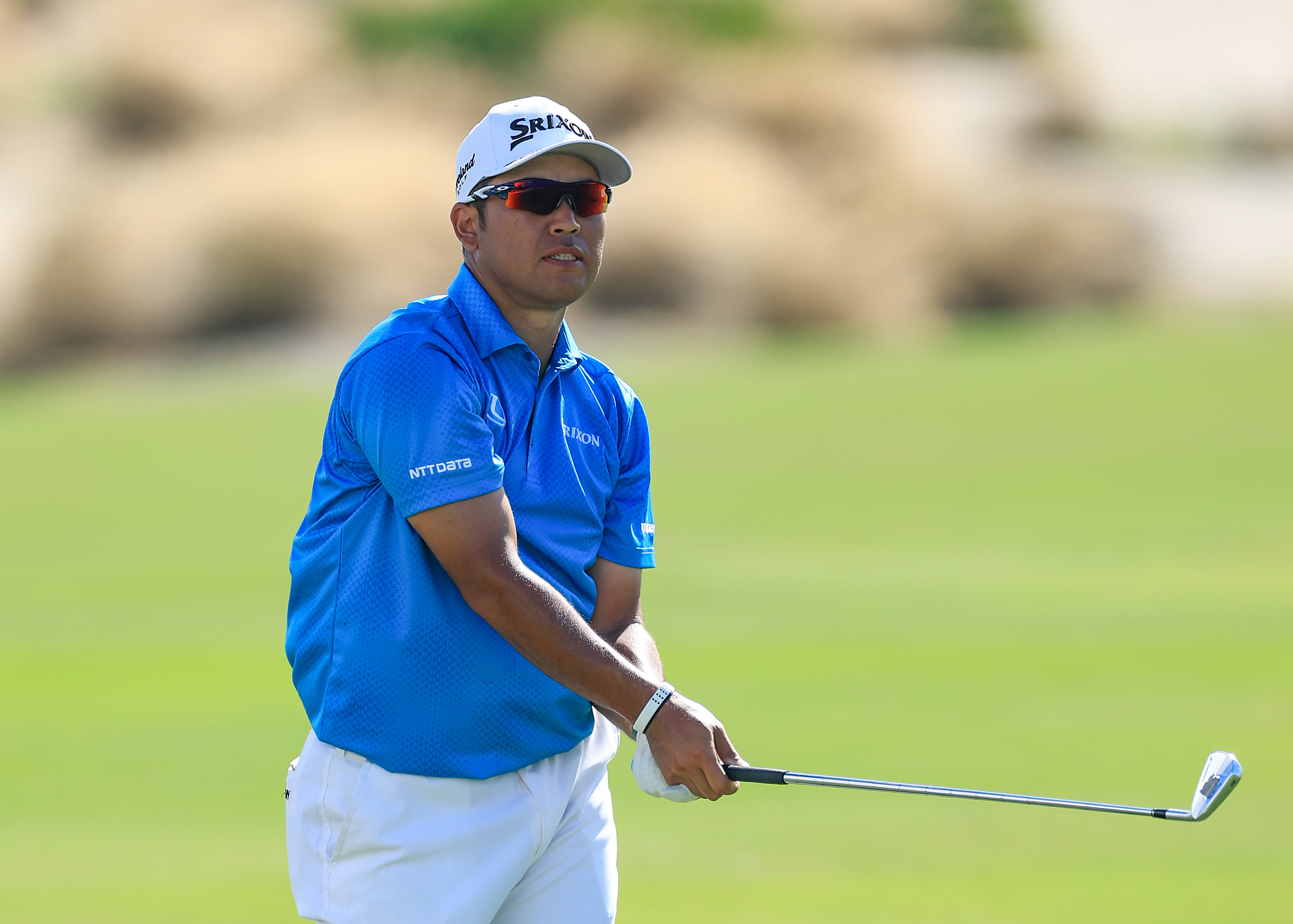 Hideki Matsuyama hits an iron shot