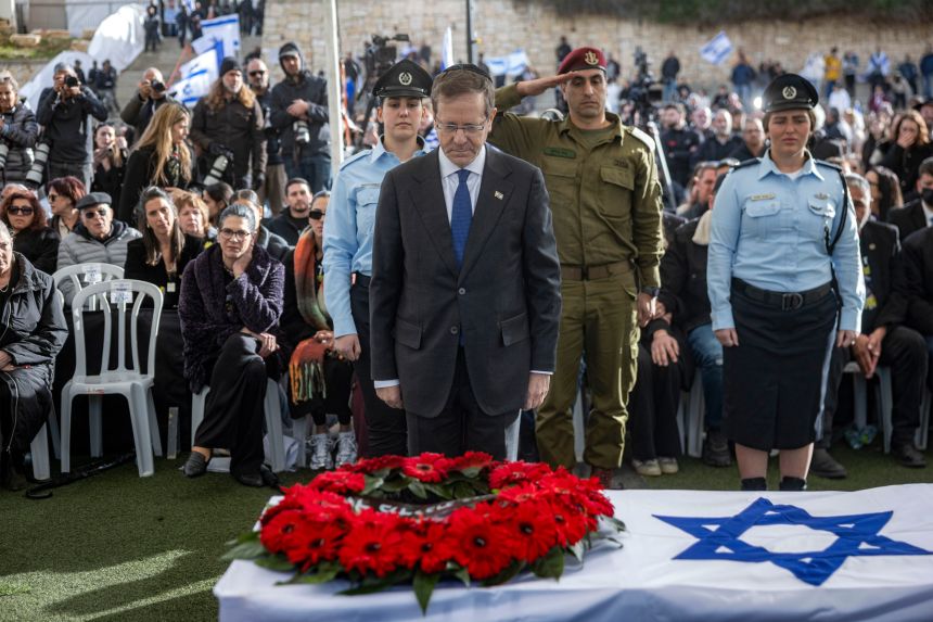 Israel's President Isaac Herzog pays his respects before the casket of Israeli hostage Ran Gvili, whose remains were brought back to Israel on Wednesday, Jan. 28, 2026.