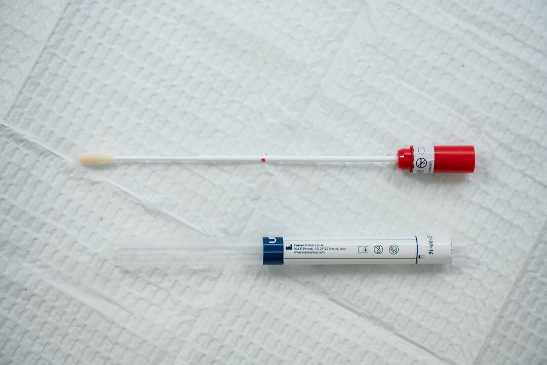 An at-home HPV cervical cancer screening device, which consists of a logn swab and a tube.