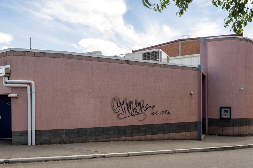 Exterior wall of a public building in a city street.