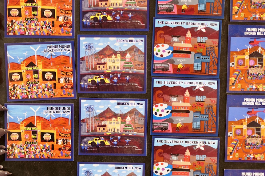 a series of magnets with artworks depicting a desert landscape