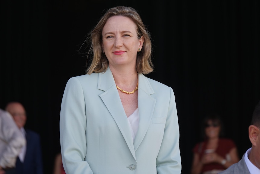 woman in suit smiling