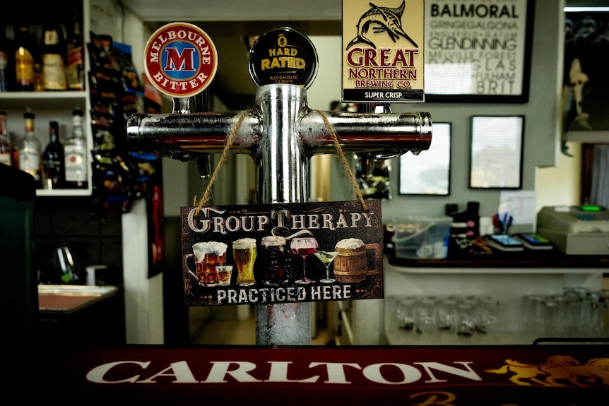A sign of the taps at the Western Hotel saying "group therapy practiced here".