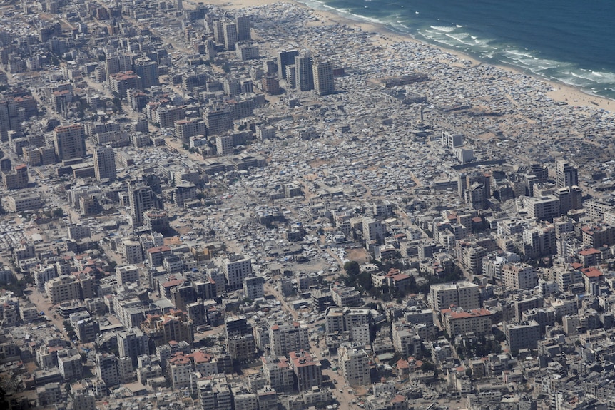An aerial image of a largely destroyed city. 