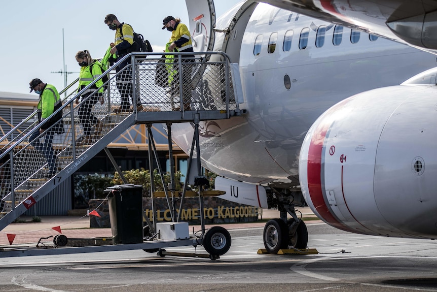 Passengers disembark a Virgin Australia flight at Kalgoorlie-Boulder Airport.