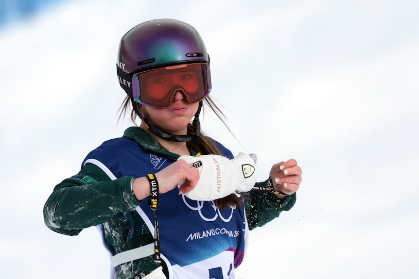 Ally Hickman pulls off her gloves