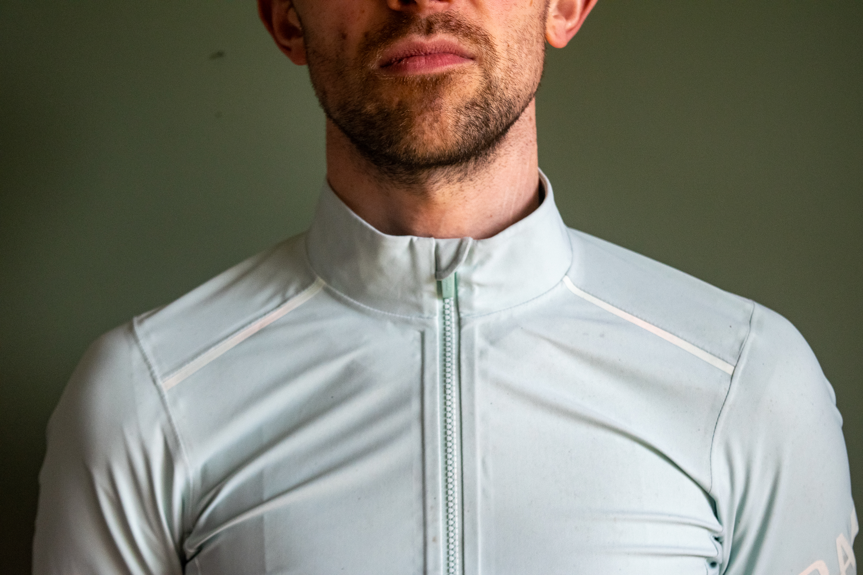 A man wearing a Rapha Shadow jersey