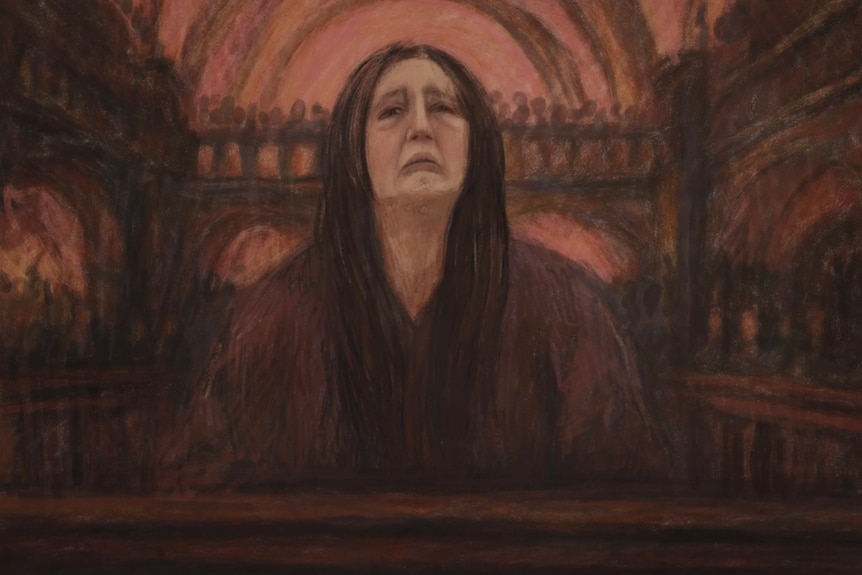 A sad looking woman in a courtroom. 