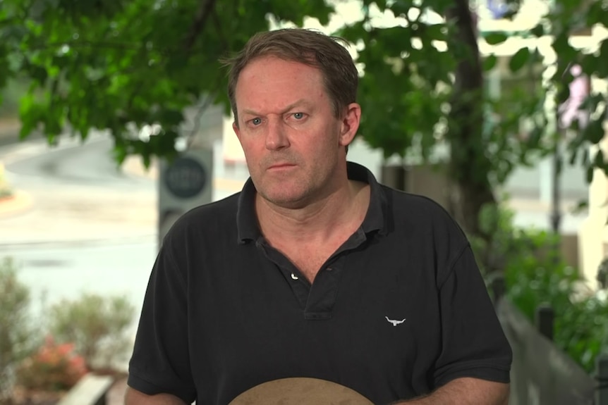 Josh teague in a garden speaking to media