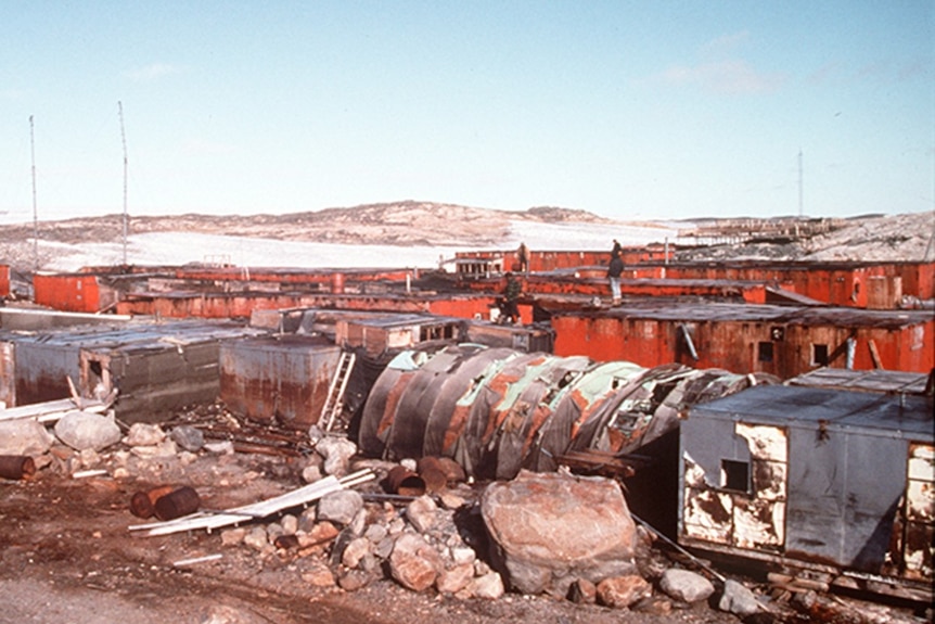Antarctic station abandoned infrastructure exposed by ice melt.