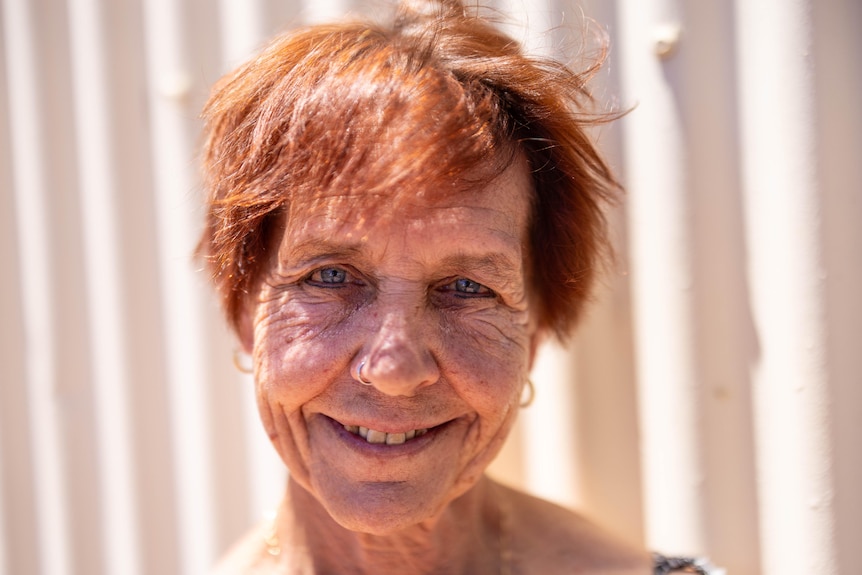 A close-up of a woman smiling.  