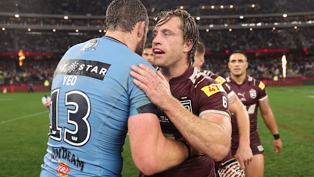 Isaah Yeo embraces Cameron Munster after game two of the 2025 State of Origin series. 