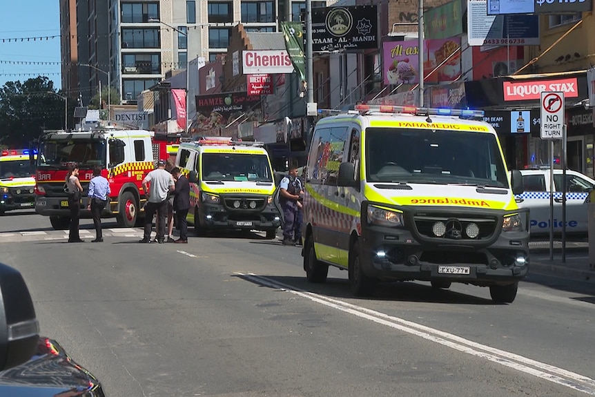 NSW Police, ambulance and fire trucks in a cordoned off main street
