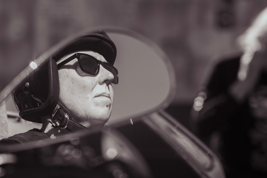 Reflection of woman in mirror.