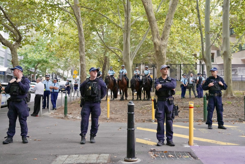 Protesters gather to rally against police brutality at Surry Hills Police Station.