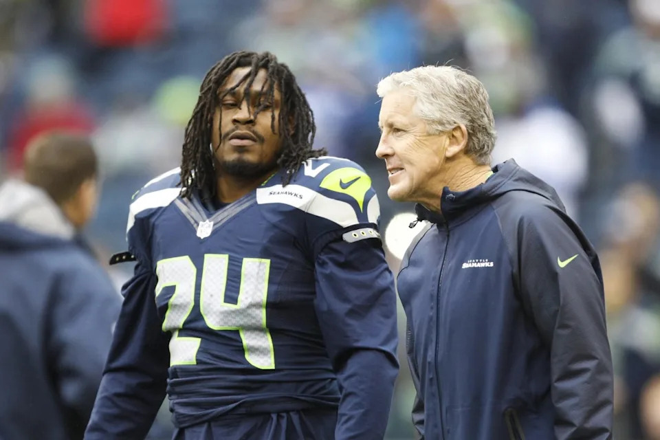 Seattle Seahawks head coach Pete Carroll talks with Seattle Seahawks running back Marshawn Lynch (24)Joe Nicholson-Imagn Images