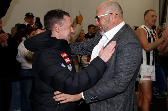 Collingwood coach Craig McCrae and CEO Craig Kelly celebrate a win last year.