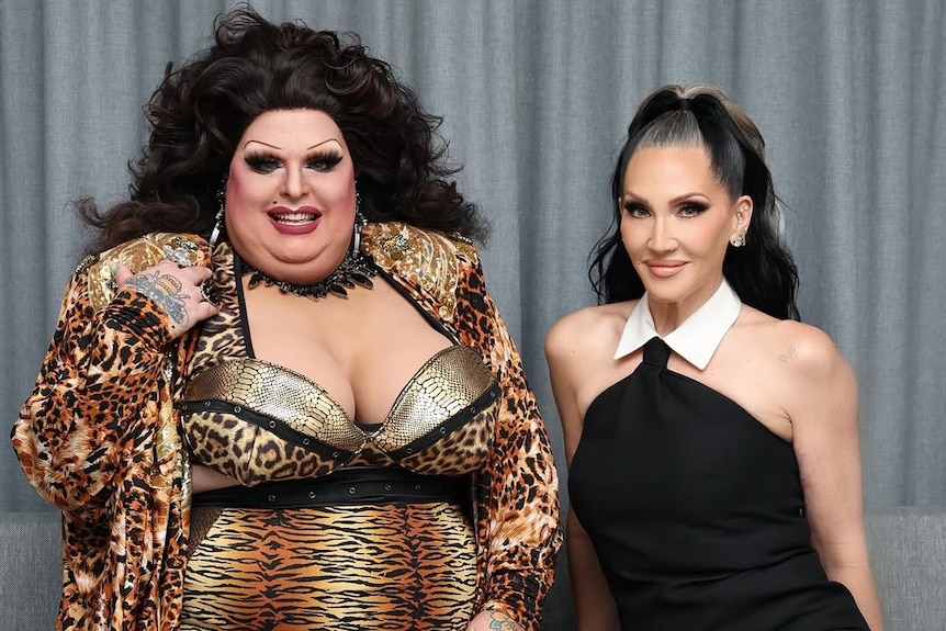 Maxi Shield in drag on the left wearing animal print, and Michelle Visage in black on the right.