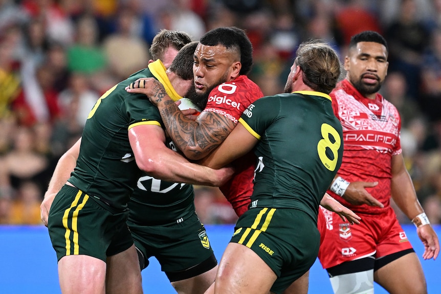 Tonga prop Addin Fonua-Blake runs into the Australian defence.