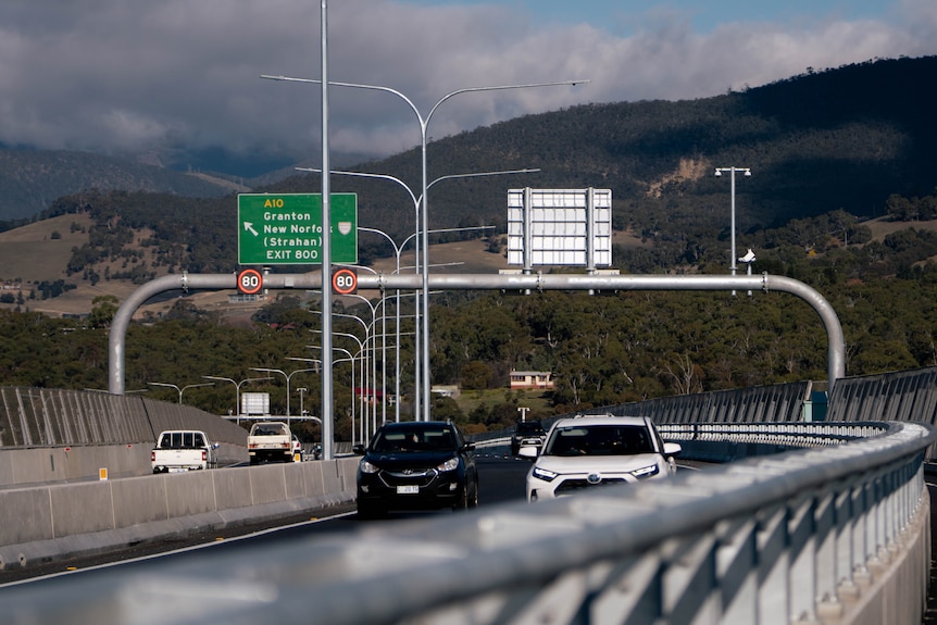 Cars driving over a bridge