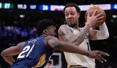 Milwaukee Bucks' Amir Coffey tries to get past New Orleans Pelicans' Yves Missi during the first half of an NBA basketball game Wednesday, Feb. 4, 2026, in Milwaukee.