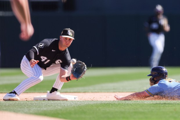 Chicago White Sox shortstop Tanner Murray (41) tags out Milwaukee Brewers third baseman Luke Adams (79) while he tries to steal second during the second inning in a Cactus League game at Camelback Ranch on Sunday, Feb. 22, 2026, in Glendale, Ariz. (Armando L. Sanchez/Chicago Tribune)