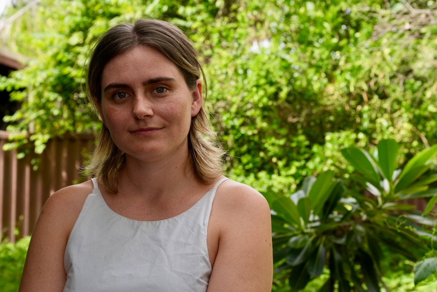 blond young woman in a garden