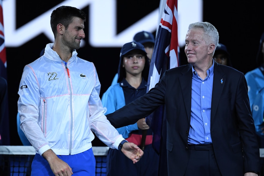 Novak Djokovic and Craig Tiley at the Australian Open trophy presentation