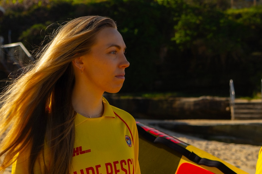 Surf lifesaver looking out at the water.