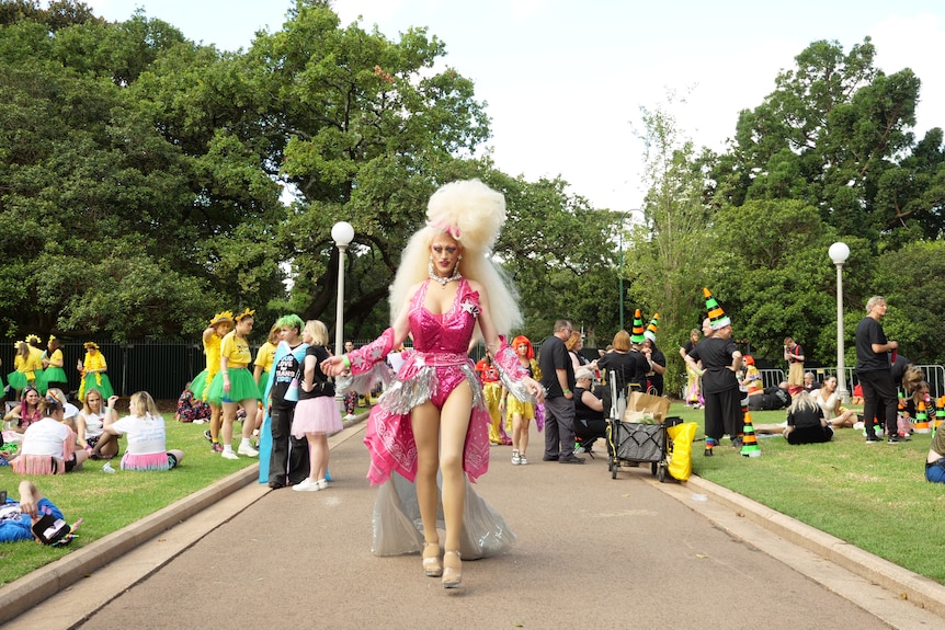 A drag queen dressed in a pink outfit
