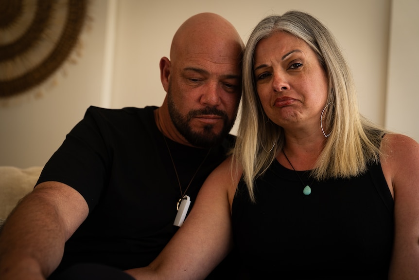 Bald man with beard and woman with silver hair.