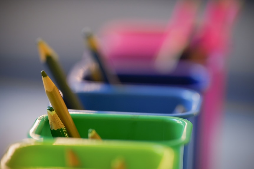 Generic education school shots in a classroom with books and pencils.