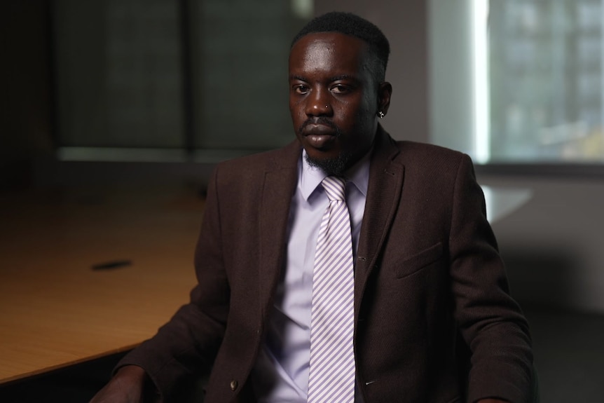 A man wearing a suit and tie.