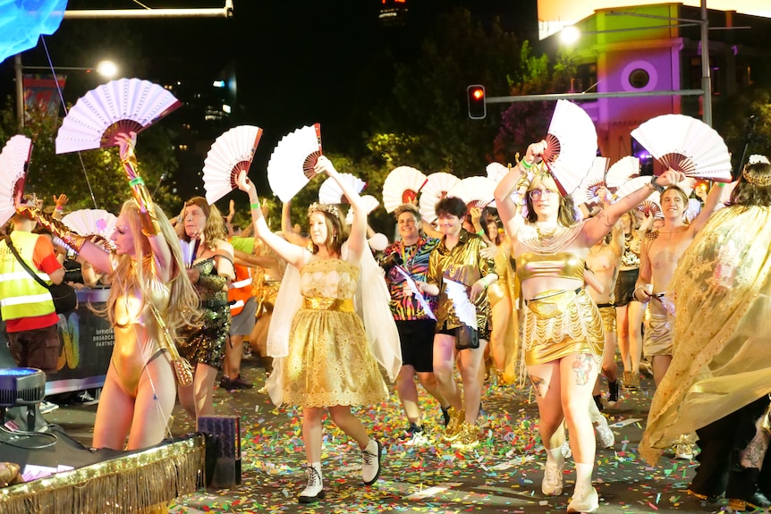 People dressed in gold outfits.